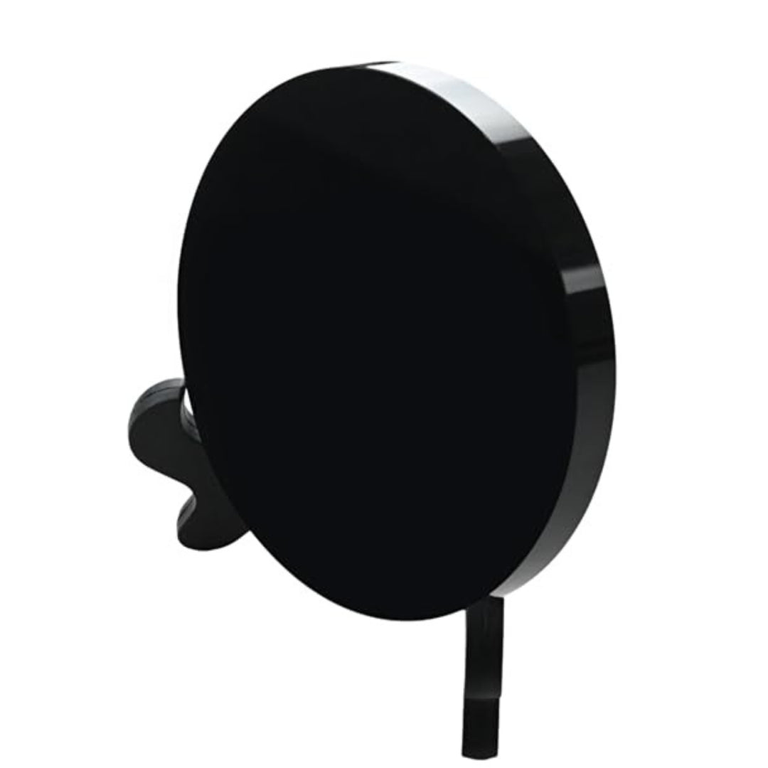 The 2.36 inch Black Obsidian Mirror viewed from the back, securely resting on a black stand for witchcraft rituals